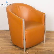 Tub chairs with it's signature round back a tub chair is just the thing to accessorize your home. Tan Leather Reception Tub Chair