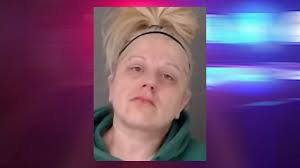 Corning woman arrested after allegedly stealing coat containing $1K