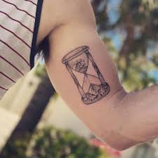 Hourglass tattoo on the inner arm