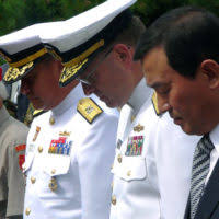 Rear Adm. Rick Williamson, Commander, Navy Region Europe, Africa, Southwest  Asia (COMEURAFSWA), answers questions from community members of Naval  Support Activity (NSA) Naples during a town hall meeting.