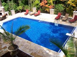 Inground pool designs directly connect to the patio area, this inground swimming pool functions not only as a pool, but also as a large fire water feature complementing the architectural design. Rectangular Inground Pool Designs Novocom Top