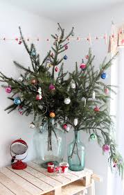 You can also paint white twigs and pinecones to add to your wreaths. 21 Ways To Decorate A Small Space For The Holidays
