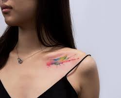 Bite The Tattoo On Your Shoulder Meaning Watercolor Paint Splash Tattoo On The Left Clavicle Tattoos For Women Tattoos Clavicle Tattoo