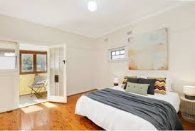 Carpet flooring in bedroom with windows and window covering. What Is The Best Bedroom Flooring Carpet Call