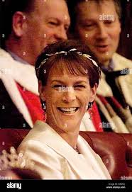 Hollywood actress Jamie Lee Curtis smiles as she sits in the House of Lords  Tuesday November 24 1998 while waiting for Britain's Queen Elizabeth II to  announce the Government's legislative plans for