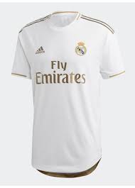 The regal design features gold accents on a classic white backdrop. Real Madrid 2019 20 Home Kit