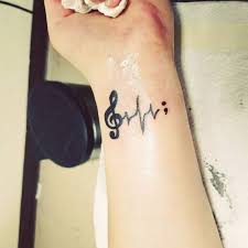 Music note tattoo on wrist. 52 Genius Music Tattoos That You Ll Want To Get For Yourself Circular Round Music Note Idea Cre Semicolon Tattoo Music Wrist Tattoos Unique Semicolon Tattoos