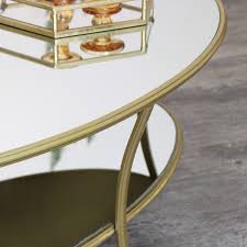 This table looks perfect cornered in sectional sofas and centered in front of loveseats. Large Glass Topped Gold Coffee Table