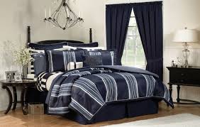 The headboard within the four poster helps soften the look of the bed frame. Home Color Idea Blue Bedroom Furniture Ideas