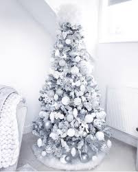 Decorate your tree, mantel and window with white snowflakes, ornaments and white painted pine cones. How To Make A White Christmas Tree The Centerpiece Of Your Holiday Decor