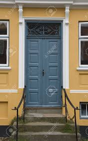 Two doors with bright colors at the entrance to a house in northern europe. Blue Door In A Yellow House At Viborg Denmark Stock Photo Picture And Royalty Free Image Image 4062344