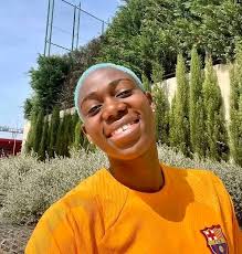 Asisat Oshoala and Leo Messi meeting