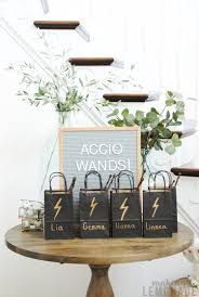 A simple white tent can be transformed into a party haven with hanging lights, themed balloons, and photo displays. Magical Harry Potter Party Ideas Making Lemonade