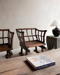 delicate antique a rustic vintage shop in taipei taiwan remodelista in 2021 antique wooden chairs sculptural chair living room lounge