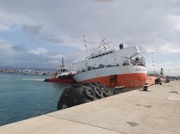 a cargo ship is being held up by