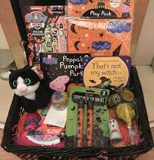 Even tiny hands can make these adorable halloween decorations—with supervision from mom or dad, of course. Diy Halloween Hamper Gift Basket For Kids Kids Halloween Gifts Toddler Halloween Gifts Diy Halloween Gifts