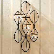 The matte black metal candle plate holds a champagne glass hurricane that can be easily removed. Propel Candle Holder Wall Sconce Buy Decorative Candle Wall Sconces Wrought Iron Candle Wall Sconces Candle Wall Sconces With Crystals Product On Alibaba Com