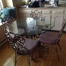 These chairs can be found at discount stores and home improvement centers at reasonable prices. Wrought Iron Kitchen Sets Ideas On Foter