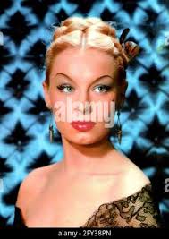 Striptease artist Lili St. Cyr leaves a Reno, Nev., courtroom after winning  a divorce from her husband Edgar Friedman, July 22, 1959. They had been  married since 1955. (AP Photo Stock Photo