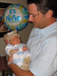 Before he was born, we were really good dog parents. So we brought him home  from the hospital in a puppy outfit. I think I felt it would get us