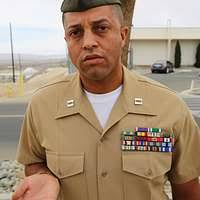 A Kazakhstanian E.O.D. (Explosive Ordance Detachment) Soldier collects old  munitions left stock piled from the old Regime, near Camp Delta, Iraq