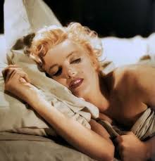 The painting, "Bus Stop" by Earl Moran, is from 1946, so I think this posed  photo was taken then, or shortly after. Norma Jeane Dougherty, as Marilyn  Monroe was called at this