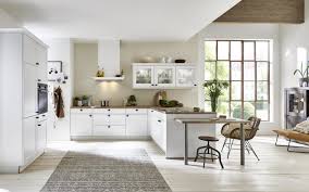 Most of the upper cabinets have their molding in place. White Kitchen With Cornices In Country Style Nolte Kuechen Com