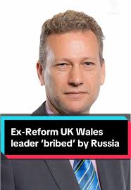Reform UK's former leader in Wales has appeared in court, accused of  accepting bribes to make favourable statements about Russia in the European  parliament. Nathan Gill