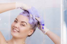 This formula gets rid of brassiness and brightens silver hair, and also contains extracts that help detangle and moisturize. Woman Applying Coloring Shampoo On Her Hair Female Having Purple Stock Photo Picture And Royalty Free Image Image 112736473