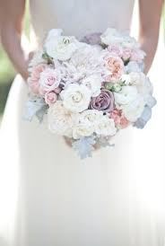 A white wedding bouquet of king proteas, white roses, berries, magnolia leaves and pale greenery. 24 Lilac Pink Cream Wedding Flowers Ideas Wedding Flowers Wedding Wedding Bouquets