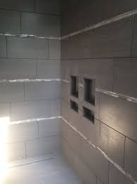 Custom Tiled Shower With 12x24 Tile Installed Horizontally With Glass And Stone Mosaic Accents Bathroom Styling Shower Tile Custom Tile Shower