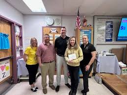 So proud of our daughter, Julie Lusk Zemojtel for being chosen as Lake  Havasu High School Teacher of the Year for 2024 yesterday. It was a great  honor and she is so