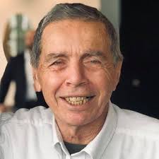 Who was the broadcast personality for WWDB show Real Estate and Your Estate?