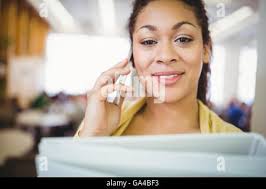 Portait of young business woman in an office with feet up