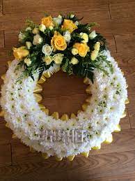 Personalised ribbon for funeral flowers adds a special touch that can be used as a keepsake afterwards. Wreath In Flowers For A Brother Funeral Flowers Wedding Arrangements White Flowers