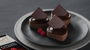 Mini Dark Chocolate And Raspberry Cheesecakes Lindt Excellence Recipe Lindt Chocolate Recipes Chocolate Desserts