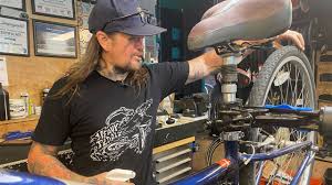 Bike shop co-owner rides bike to avoid gas prices