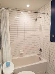 The bright white ice ceramic wall tile is suitable for use on walls but is not suitable for use on floors. American Standard Cambridge Tub Tile From Tub To Ceiling White Vanity Blue Walls Pivo White Subway Tile Bathroom Bathroom Wall Tile Bathroom Remodel Shower