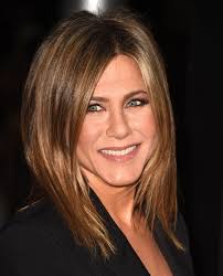 The base is light brown, and it's enhanced throughout with golden blonde highlights. Jennifer Aniston Hair Evolution Timeline Of Jen Aniston S Hairstyles
