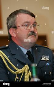 Group Captain Chris Birks, Base Commander at RAF Kinloss, Scotland in front  of a Nimrod aircraft Stock Photo