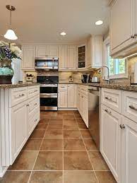 For further proof that basic tile shapes can shine, peek inside this soothingly subdued kitchen, which lets pops of emerald green shine against white cabinetry and understated slate gray floors. Ceramic Tile Kitchen Floor Tile Ideas With White Cabinets Novocom Top