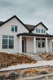 When we moved in almost 18 months ago, our red brick cape cod style home had yellow trim and hunter green shutters. What Actually Building Your First Home Is Like Color Chic White Exterior Houses White Brick Houses New Home Designs