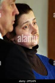 Michelle Mingo, right, listens during a hearing in Taunton Superior Court,  in Taunton, Mass., Tuesday, Feb. 10, 2004, as her defense attorney Alan  Zwirblis, left, looks on. Mingo pleaded guilty to two