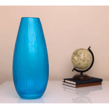 This precious murano glass vase in a mesmerizing hue of turquoise boasts an ovoid silhouette inspired by greek and roman amphorae and recalls the shape of a drop (goccia in italian). Hand Blown Glass Argos Vase Blue Glass Vase Blue Vase Tall Vase Centerpiece Vase