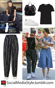 Aesthetic Black And White Striped Pants Outfit Ideas Kylie Jenner S Black Shirt Striped Pants Mini Backpack And White Sneakers Black Shirt Outfits Stripe Pants Outfit Celebrity Outfits