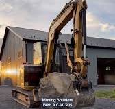 Cleaning Rocks with a Mini Excavator for Landscaping