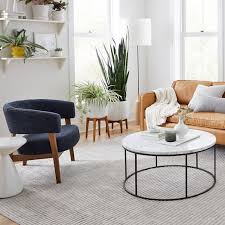 Streamline Round Coffee Table Marble It lets you create a warm and inviting look with your favorite decor, collectibles, potted plants etc.