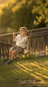 For years the idea of wallpaper was a tacky way to decorate because the patterns available were not pleasing. Cute Little Boy Play Swing Childhood 750x1334 Iphone 8 7 6 6s Wallpaper Background Picture Image