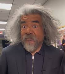 This is George Lopez with hair and makeup already done for a TV interview.  What happened? The anti-Trump comedian is only 63 years old...