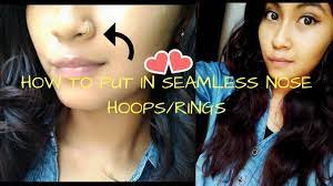 Now with the other hand, gently pull up the hinged section. How To Put In Seamless Nose Hoop Rings Youtube